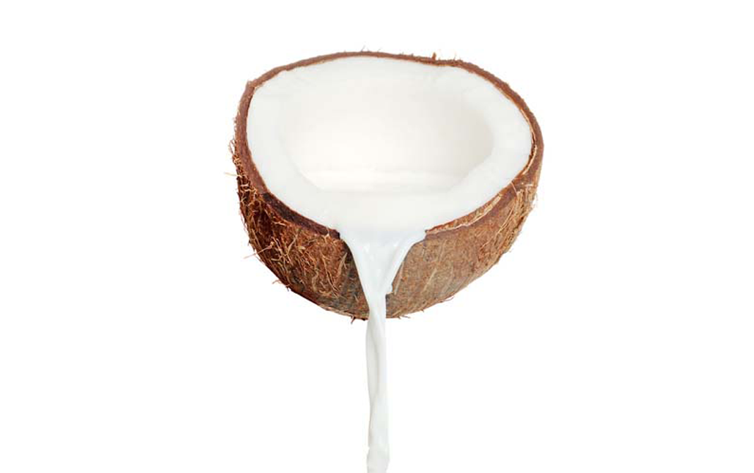 Coconut milk is naturally found inside mature coconuts, stored within cocon...
