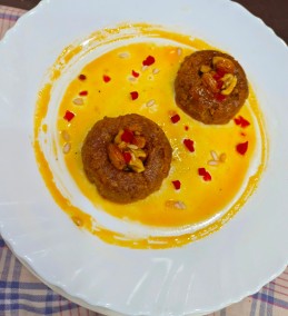 Besan delight with carmelized nuts in kesar syrup recipe